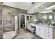 Elegant bathroom with double vanity and large shower at 8107 Sierra Manor Ln, Tampa, FL 33635