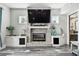 Modern fireplace with stone surround and built-in storage at 8107 Sierra Manor Ln, Tampa, FL 33635