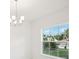Dining area with large window and chandelier at 4013 Chadwick Ave, Spring Hill, FL 34609