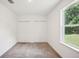 Well-lit bedroom with double closets and window at 4013 Chadwick Ave, Spring Hill, FL 34609