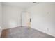 Spacious bedroom with carpet and access to hallway at 4013 Chadwick Ave, Spring Hill, FL 34609