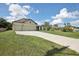 House exterior and driveway with green lawn at 4013 Chadwick Ave, Spring Hill, FL 34609