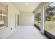 Screened porch with access to backyard and interior at 4013 Chadwick Ave, Spring Hill, FL 34609