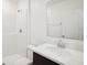 Clean bathroom, featuring a shower/tub combo, vanity with sink and mirror at 4013 Chadwick Ave, Spring Hill, FL 34609