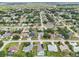Aerial view of a residential neighborhood with single-Gathering homes and lush landscaping at 4013 Chadwick Ave, Spring Hill, FL 34609