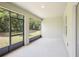 Spacious screened-in porch with access to backyard at 4013 Chadwick Ave, Spring Hill, FL 34609