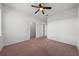 Bedroom with carpet, ceiling fan, and double closets at 18001 Richmond Place Dr # 511, Tampa, FL 33647