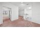 Spacious living room with carpet flooring and access to the kitchen at 18001 Richmond Place Dr # 511, Tampa, FL 33647