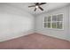 Bright bedroom with carpet and ceiling fan at 18001 Richmond Place Dr # 511, Tampa, FL 33647