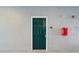 Green apartment building entrance with fire extinguisher and address numbers at 18001 Richmond Place Dr # 511, Tampa, FL 33647