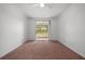 Bright bedroom with carpeted floors and sliding glass doors to balcony at 18001 Richmond Place Dr # 511, Tampa, FL 33647
