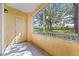 Screened porch with view of trees and lawn at 18001 Richmond Place Dr # 511, Tampa, FL 33647