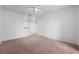 Bright living room with a ceiling fan and carpeted floors at 18001 Richmond Place Dr # 511, Tampa, FL 33647