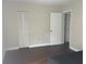 Bedroom with dark hardwood floors and a closet at 13300 Walsingham Rd # 52, Largo, FL 33774