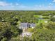 Stunning aerial view of a large home with circular driveway at 17318 Hanna Rd, Lutz, FL 33549