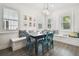 Charming breakfast nook with built-in bench seating and a dark wood table at 17318 Hanna Rd, Lutz, FL 33549