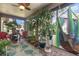 Lush screened porch with seating and a hammock at 4623 Oak Hill Ter # 32, Sarasota, FL 34232