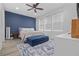 Spacious bedroom with blue accent wall, comfortable bed, and stylish rug at 41 29Th N St, St Petersburg, FL 33713