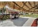 Community grilling station with thatched roof covering at 5286 81St N St # 4, St Petersburg, FL 33709