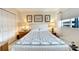 Serene bedroom with a bed, nightstands, and window with blinds at 5286 81St N St # 4, St Petersburg, FL 33709
