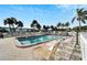 Inviting community swimming pool with surrounding patio at 5286 81St N St # 4, St Petersburg, FL 33709