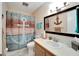Bathroom with nautical-themed decor, shower/tub combo, and vanity at 5286 81St N St # 4, St Petersburg, FL 33709