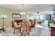 Bright dining room with glass table and decorative plates at 5286 81St N St # 4, St Petersburg, FL 33709