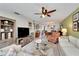 Spacious living area with sectional sofa, dining area view, and ceiling fan at 5286 81St N St # 4, St Petersburg, FL 33709