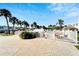 Community pool area with plenty of lounge chairs and surrounding palm trees at 5286 81St N St # 4, St Petersburg, FL 33709