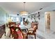 Charming dining room with glass-top table and wood chairs at 5286 81St N St # 4, St Petersburg, FL 33709