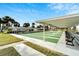 Community shuffleboard courts with covered seating at 5286 81St N St # 4, St Petersburg, FL 33709