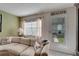 Living room with sectional sofa, view of patio, and beach decor at 5286 81St N St # 4, St Petersburg, FL 33709