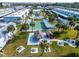 Aerial view of community with shuffleboard, tiki hut and BBQ area at 5286 81St N St # 4, St Petersburg, FL 33709
