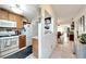 Kitchen features wood cabinets, white appliances, and a breakfast bar at 5286 81St N St # 4, St Petersburg, FL 33709