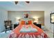 Bright bedroom with a comfortable bed, nightstands, and a relaxing armchair at 5286 81St N St # 4, St Petersburg, FL 33709