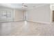 Living room with gray tile flooring, neutral walls and sliding door at 16208 Saint Michelle Ct # 104, Tampa, FL 33647