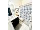 Small bathroom with shower/tub combo and patterned curtain at 6269 Camino Dr, Apollo Beach, FL 33572