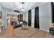 Spacious living room featuring a gray couch and open floor plan at 7010 N Hubert Ave, Tampa, FL 33614