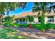 House with screened patio and lush green backyard at 9211 Green Pines Ter, New Port Richey, FL 34655