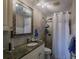Clean bathroom, granite countertop, tiled shower, and white toilet at 3507 59Th W Ave # 4020, Bradenton, FL 34210