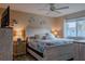 Main bedroom with king bed, coastal decor, and TV at 3507 59Th W Ave # 4020, Bradenton, FL 34210