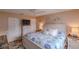 King-size bed, dresser, and coastal decor in bedroom at 3507 59Th W Ave # 4020, Bradenton, FL 34210