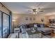 Living room with sectional sofa, wood floors, and access to patio at 3507 59Th W Ave # 4020, Bradenton, FL 34210
