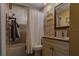 Bathroom with tub, shower, granite vanity, and tile at 3507 59Th W Ave # 4020, Bradenton, FL 34210