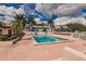 Inviting community pool surrounded by palm trees at 3507 59Th W Ave # 4020, Bradenton, FL 34210