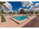 Community pool with brick deck and lush landscaping at 3507 59Th W Ave # 4020, Bradenton, FL 34210