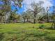 Property view showing house and expansive front yard at 12910 Pritchart Rd, Parrish, FL 34219