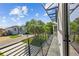 Balcony with modern metal railing and neighborhood view at 7639 Gulf Way, Hudson, FL 34667