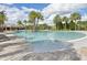 Community pool with a relaxing atmosphere and plenty of lounge chairs at 11836 Meadowgate Pl, Bradenton, FL 34211