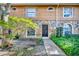 Townhouse with stone and wood siding, lush landscaping at 5308 Rollinsford Ct, Tampa, FL 33624